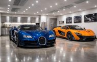 Collection automobile avec Bugatti Veyron et McLaren P1 dans garage climatisé premium